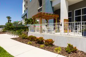 commercial condo hoa property flower planting bed pergola patio sidewalk