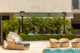 palms chairs seating poolside commercial