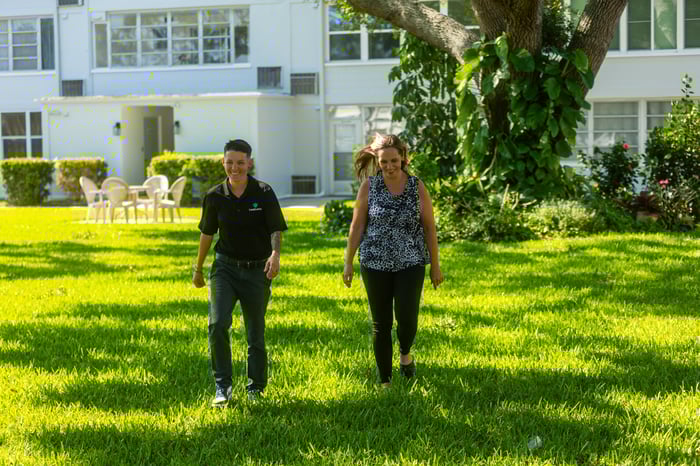 landscaper consulting with property manager in Florida