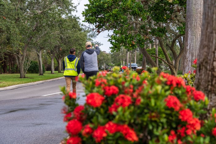 Account manager and Hoa board member walking property 4