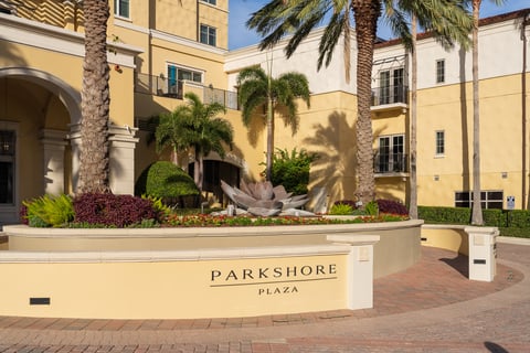 entrance to commercial buildings with palm trees