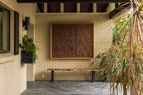 residential landscaping with outdoor artwork