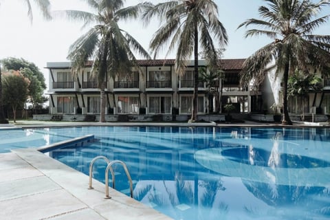 commercial property with pool and palm trees